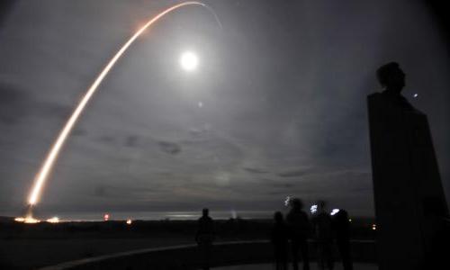 A missile being launched at night