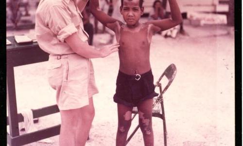 Dr. Conrad Examines Native Boy on Kwajalein